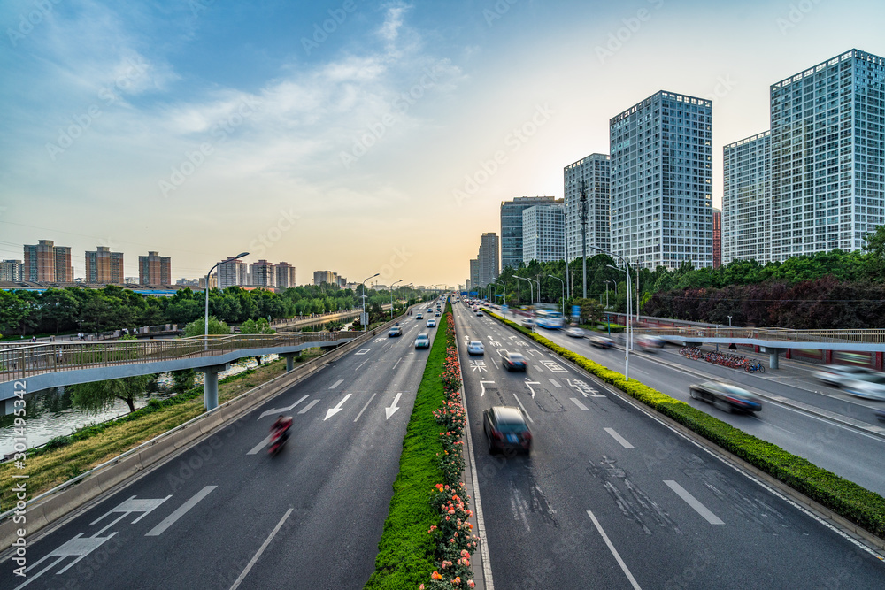 City road with moving car, Beijing, china. (road name in the Concrete road)