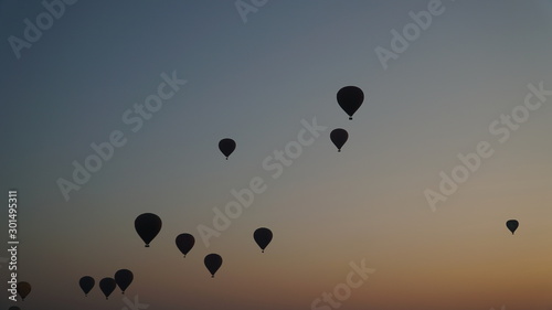 Many hot air balloons above Bagan in Myanmar with sunrise time.