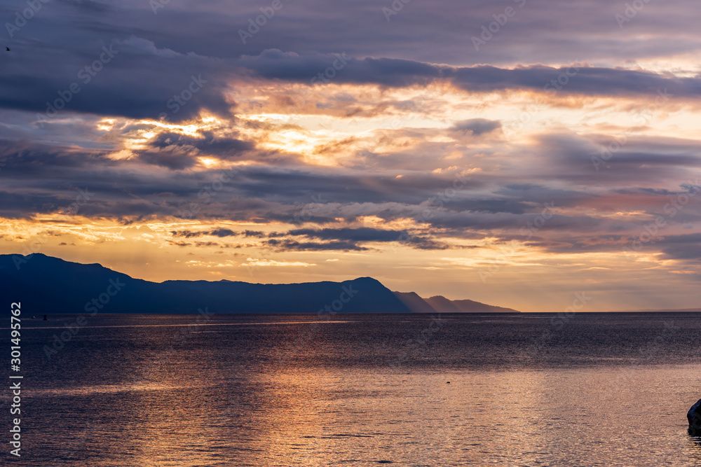 View of ocean sunset over mountains in beautiful British Columbia.