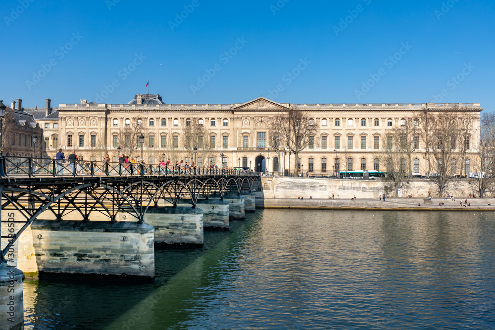 27 FEB 2019 - Paris, France - The pont des Arts and the Louvre Palace