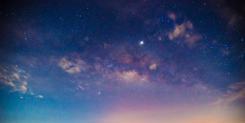 Panorama blue night sky milky way and star on dark background.Universe filled, nebula and galaxy with noise and grain.Photo by long exposure and select white balance.Dark night sky.