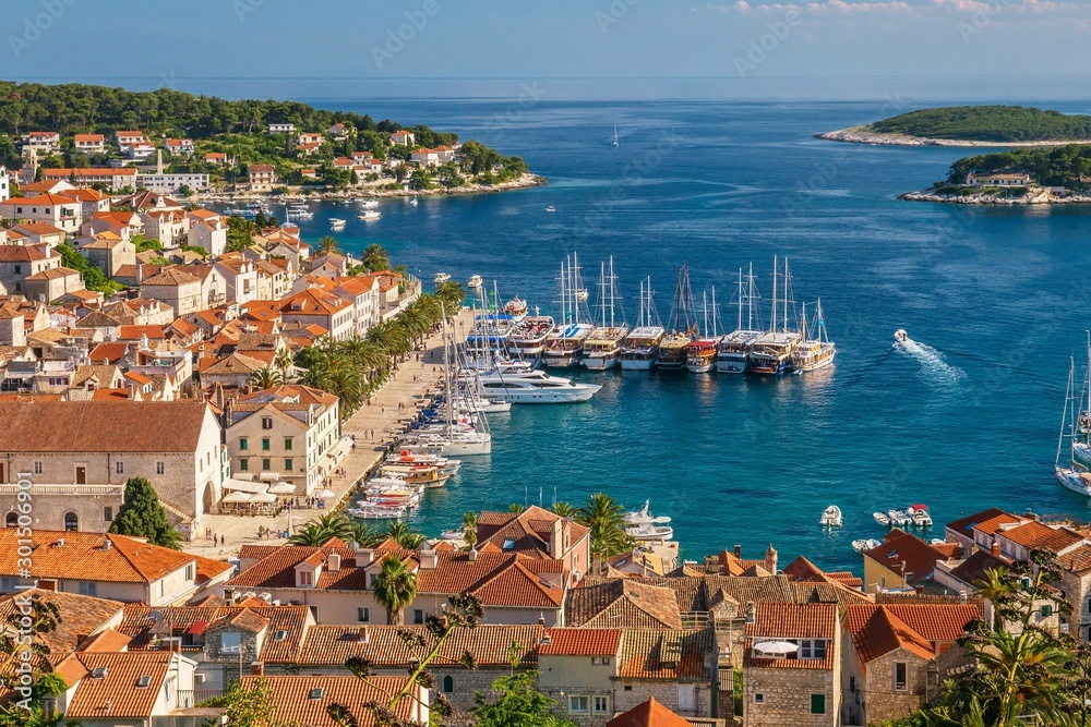 The old town and yacht harbor of the beautiful and popular tourist resort island of Hvar, a Dalmatian island in the Adriatic Sea in Croatia. 