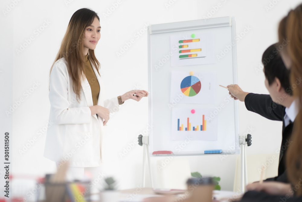 Beautiful Asian business woman are present business report in company, business concept. Beautiful Asian business woman are present business report in company, business concept.