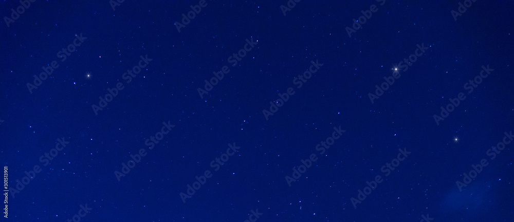 Panorama blue night sky milky way and star on dark background.Universe filled with stars  nebula and galaxy with noise and grain.Photo by long exposure and select white balance.Dark night sky.