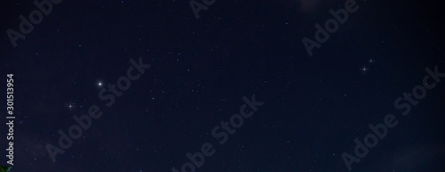 Panorama blue night sky milky way and star on dark background.Universe filled with stars  nebula and galaxy with noise and grain.Photo by long exposure and select white balance.Dark night sky.