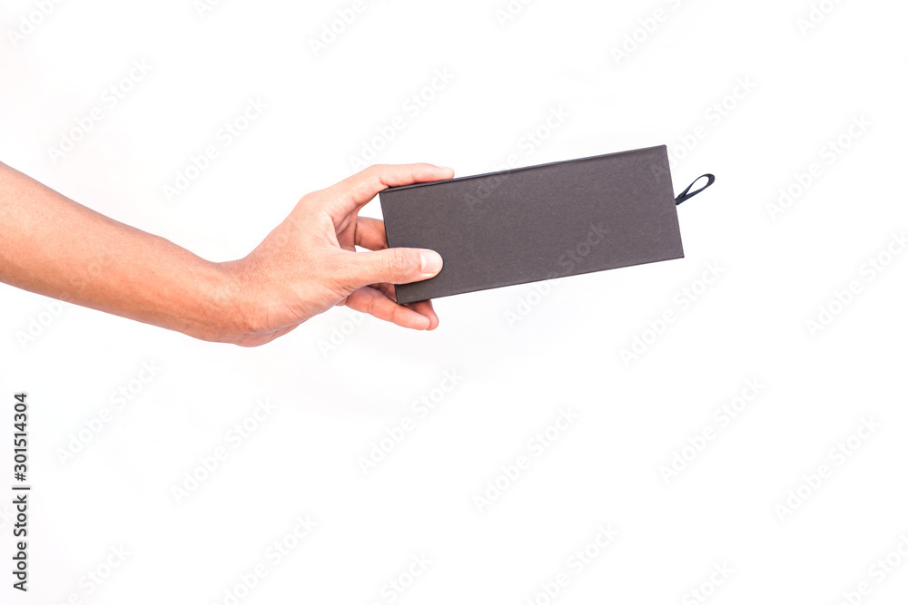 Hand holding a black box, a modern black box. Hand holding a black box, a modern black box.