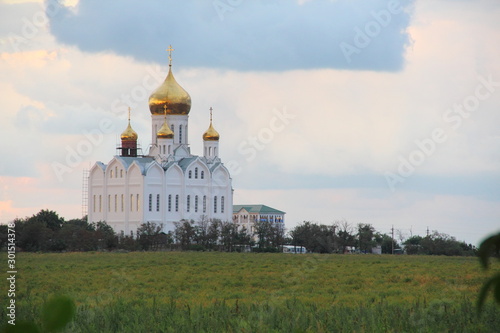 Church with golden domes. Orthodox church with golden domes