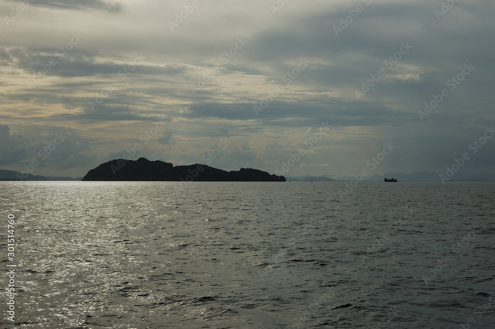 The evening sun reflecting in the water on the way from Koh Tao to Chumphon, Thailand The evening sun reflecting in the water on the way from Koh Tao to Chumphon, Thailand