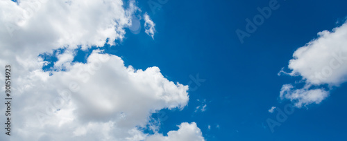 Fototapeta Naklejka Na Ścianę i Meble -  White clouds cumulus floating on blue sky for backgrounds concept,
For putting text or advertising products.panorama.
