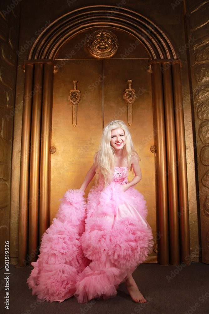 Sexy slim blonde in fashion pink cloud dress with gorgeous long gown. Sexy slim blonde in fashion pink cloud dress with gorgeous long gown.