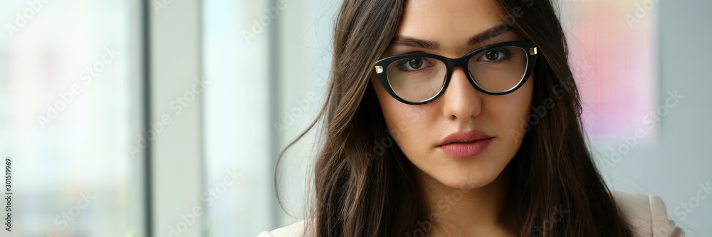 Beautiful smiling girl at workplace look in camera portrait