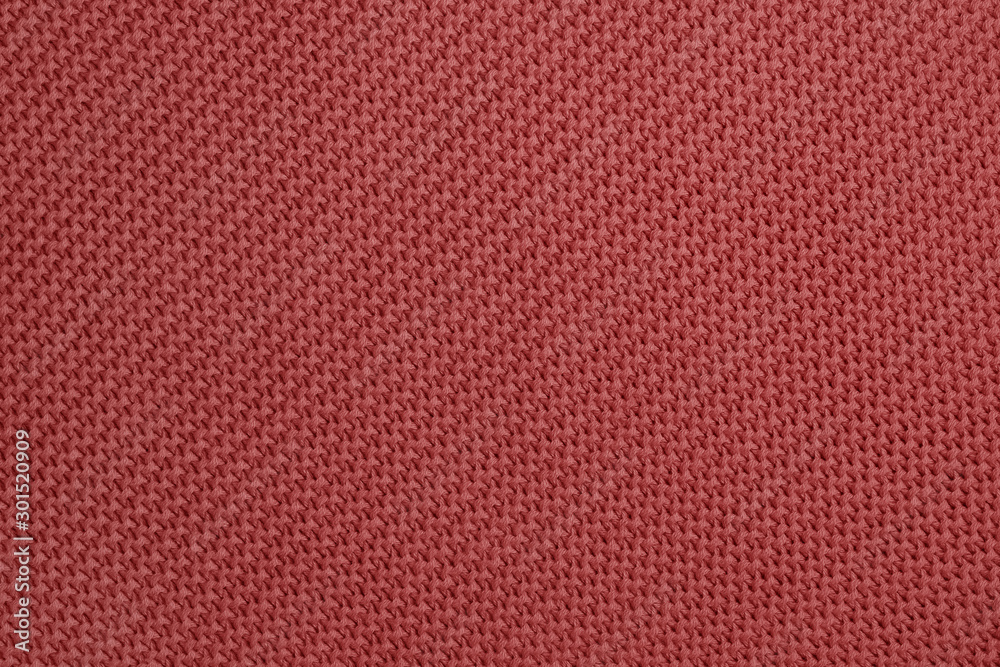 Fototapeta premium Knitted background of redwood color. Detailed diagonal knitting texture. Garter stitch pattern