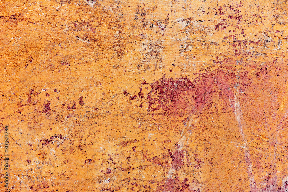 Texture of a concrete wall with cracks and scratches which can be used as a background Texture of a concrete wall with cracks and scratches which can be used as a background