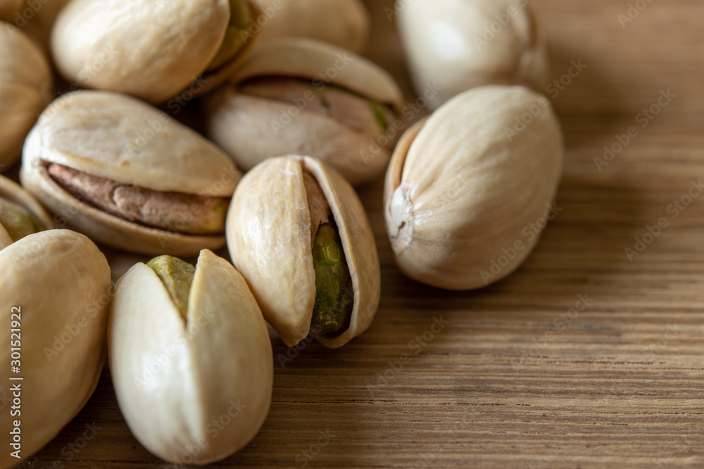Close-up Pistachio nut on wood background Close-up Pistachio nut on wood background