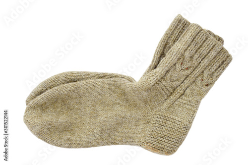 Handmade knitted wool socks isolated on a white background. Square Dutch heel and owl ornament on the top. Copy space photo