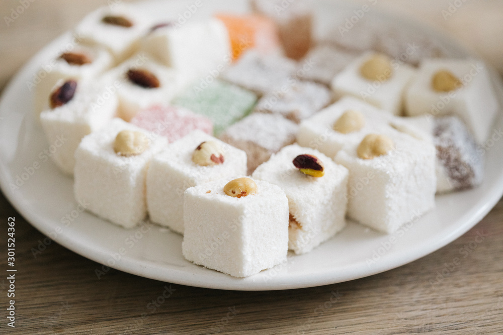 Tasty oriental sweets (Turkish delight lokum) with powdered sugar