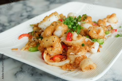 Fried squids or octopus (calamari) with chilli and garlic
