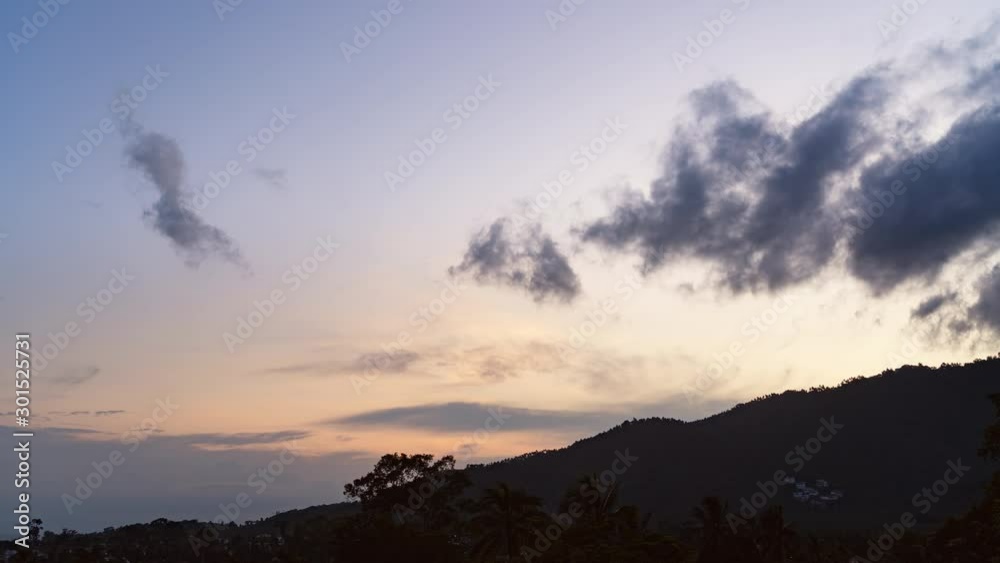 Colourful sunset over mountains and trees on a tropical island. 4k time lapse Colourful sunset over mountains and trees on a tropical island. 4k time lapse