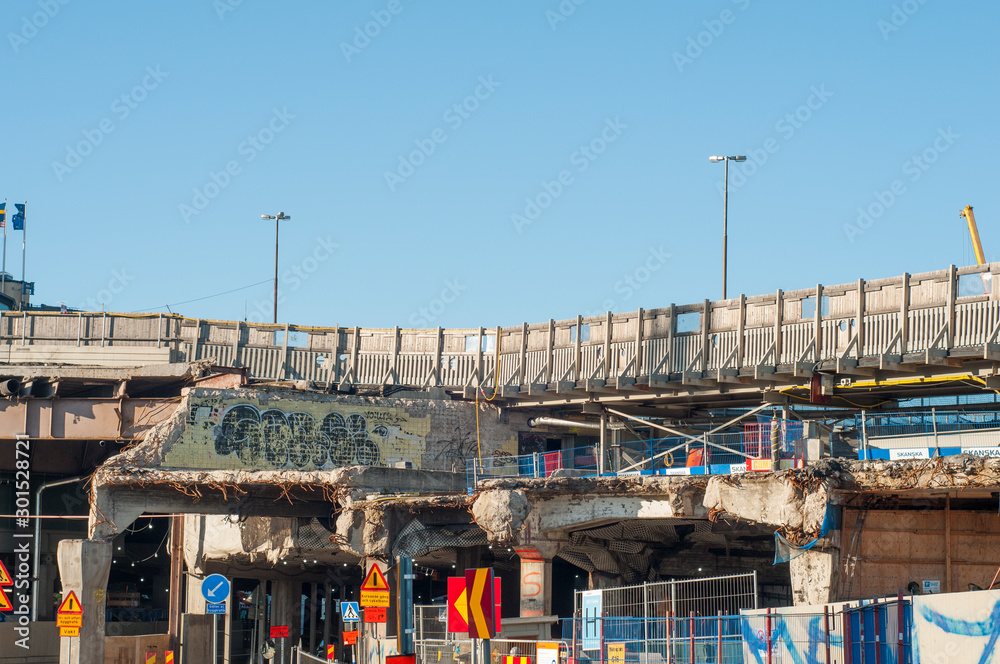 Demolished bridge. Destroyed building. Demolition of the structure. Reinforcement and concrete.