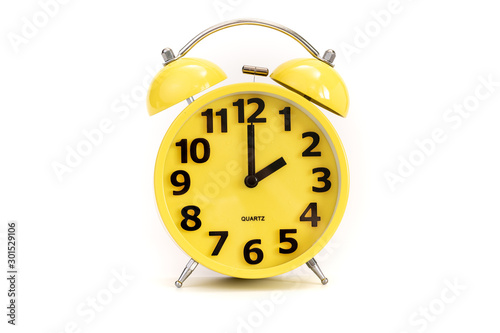 Yellow alarm clock on white at 2 o'clock