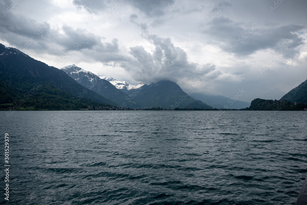 Charming panorama view of lake Brienz with cloudy sky and mountain for background, Switzerland