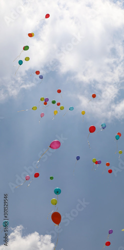 colorful balloons on the sky with clouds