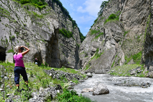 Nort Ossetia, Russia, June, 23, 2019. Tourist photographing Karmadon (Geldeston) gorge in the summer. Republic of North Ossetia - Alania. Russia