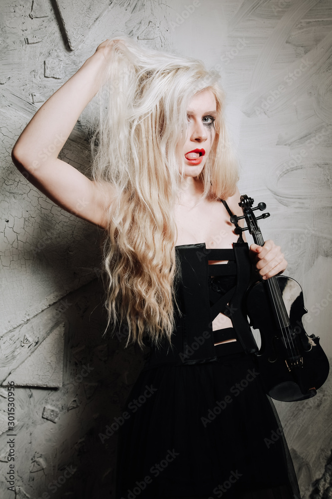 Blonde Gothic Girl with violin on white background. Young woman on the party. Blonde Gothic Girl with violin on white background. Young woman on the party.