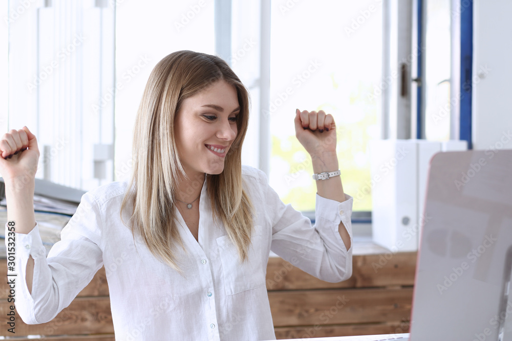 Beautiful joyful woman at workplace using computer pc Beautiful joyful woman at workplace using computer pc