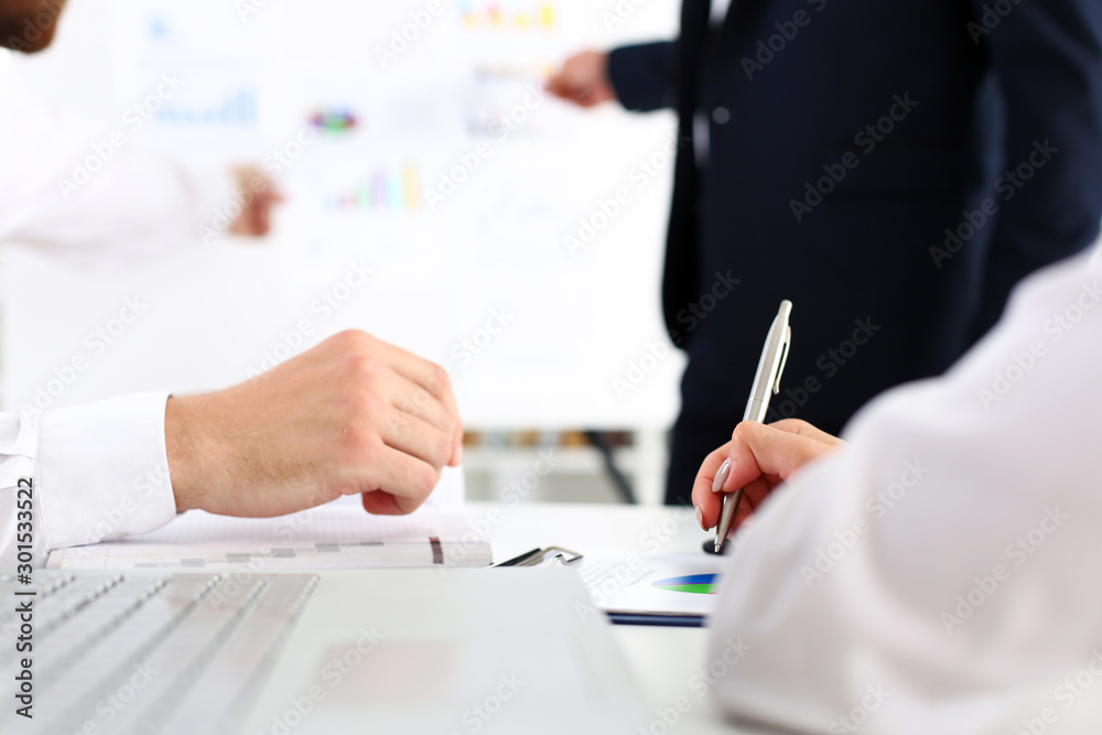Group of people deliberate on white board problem Group of people deliberate on white board problem