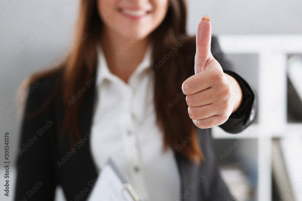 Beautiful smiling woman showing OK or approval sign Beautiful smiling woman showing OK or approval sign