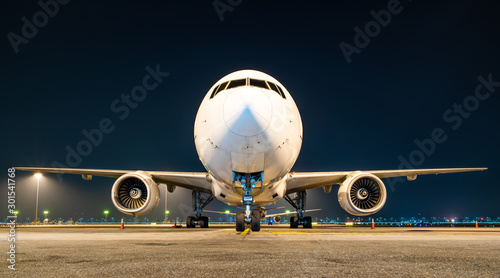 aircraft parking at gate in night