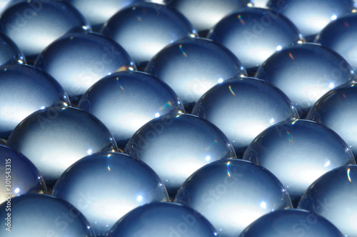 Close-up large glass balls lie next to each other