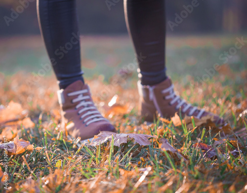Woman legs boots in autumn nature © erainbow