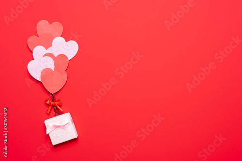 Fotótapéta Valentine's day background with red and pink hearts like balloons on pink backgr