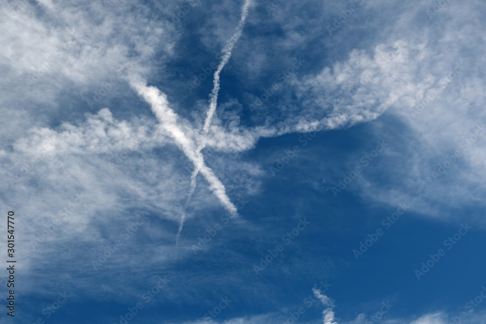 blue sky, white clouds and a trace from the plane blue sky, white clouds and a trace from the plane