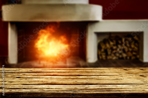 Table background of free space and home interior with fireplace  © magdal3na
