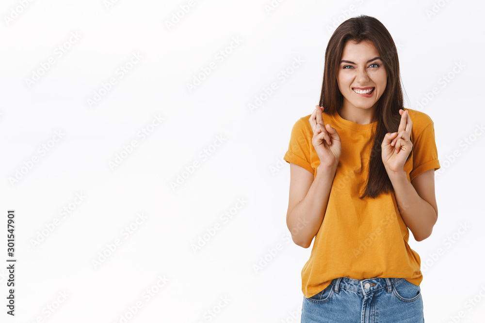 Optimistic, excited cute girl put all mind and powers for wish come true, cross fingers good luck, biting lip eager to become winner, smiling squinting awaiting results, dream or praying Optimistic, excited cute girl put all mind and powers for wish come true, cross fingers good luck, biting lip eager to become winner, smiling squinting awaiting results, dream or praying