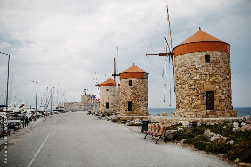 Windmills in the Mandraki port of Rhodes, Greece