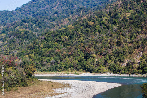 Scenic view of water flow between hills in Manas National Park, Assam, India