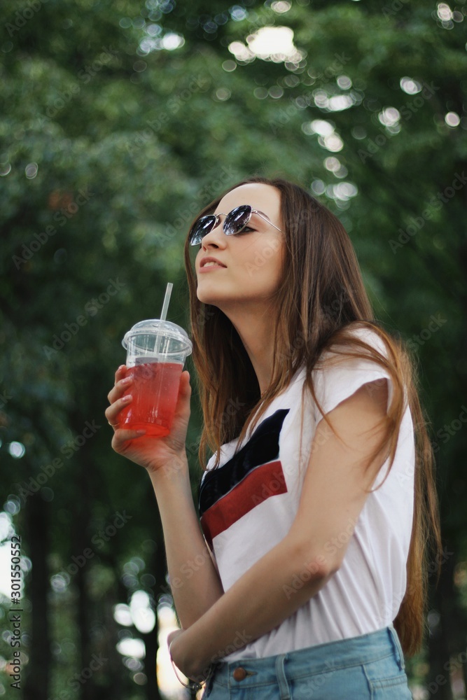 Young pretty girl walking down the street