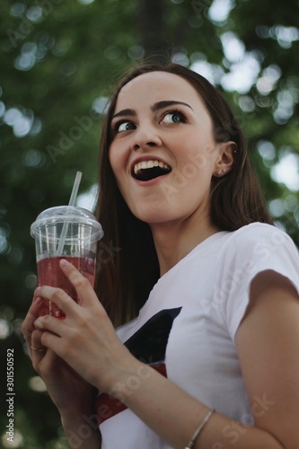 Young pretty girl walking down the street