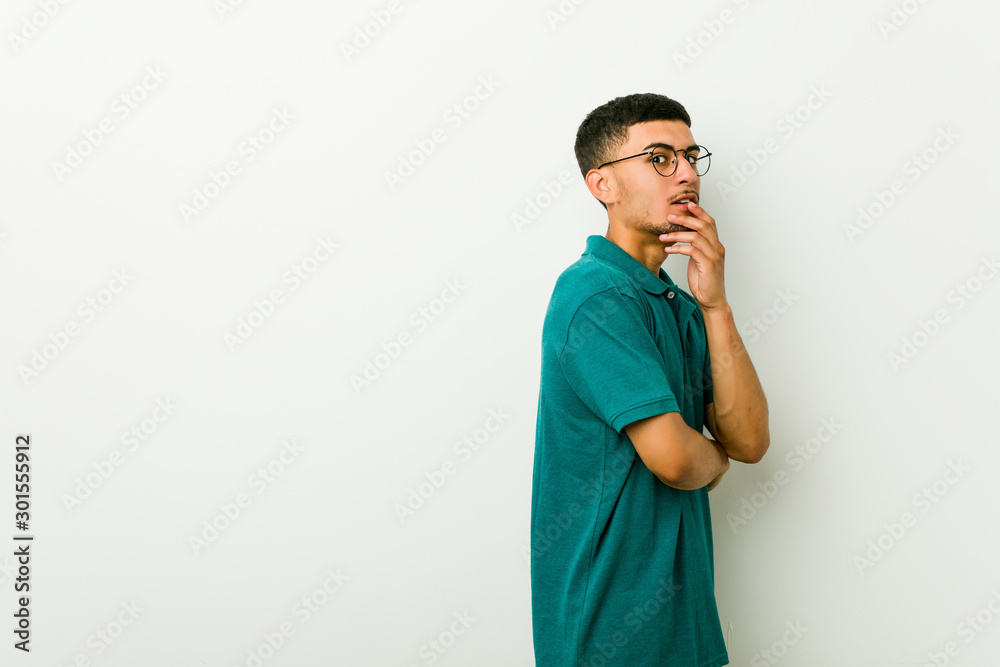 Young hispanic man scared and afraid. Young hispanic man scared and afraid.