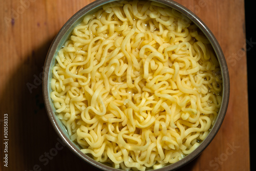 cup with instant noodles. yellow wheat noodles