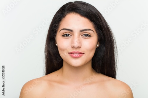 Close up of a young beautiful and natural hispanic woman