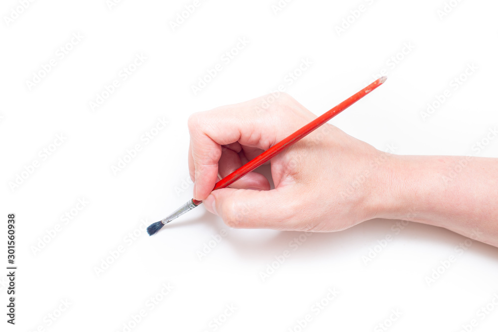 Hand with brush isolated on white Hand with brush isolated on white