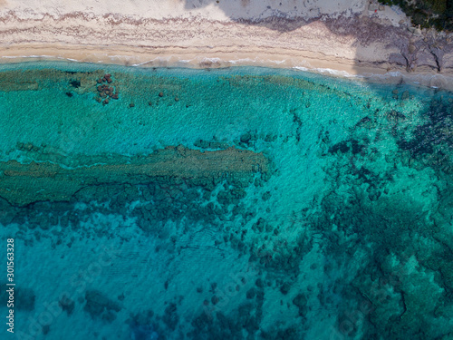 Aerial view of a seabed with rocks emerging from the sea, seabed seen from above, transparent water. Riaci, Tropea, Calabria, Italy