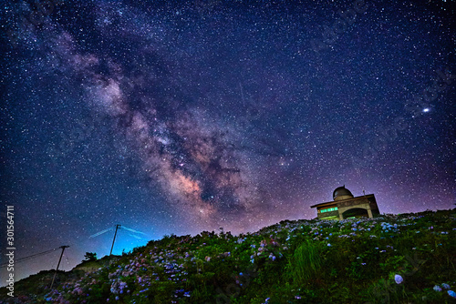 Milky way and the observatory on the flowery hill in Tokushima, Japan photo