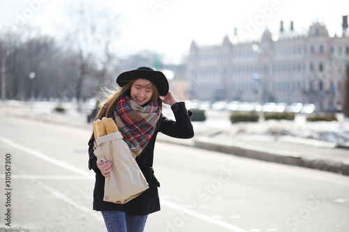 French woman with baguettes in the bag