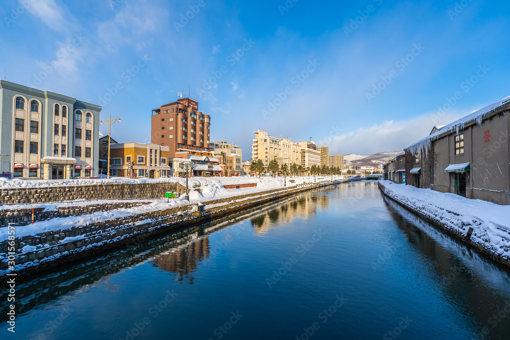 Beautiful landscape and cityscape of Otaru canal river in winter and snow season